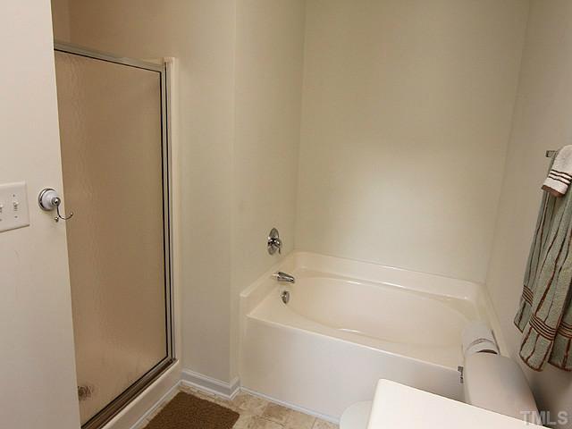 678 Citrus Petal Road Fuquay-Varina, NC 27526 - Photo 7 of 14 a bathroom with a bathtub