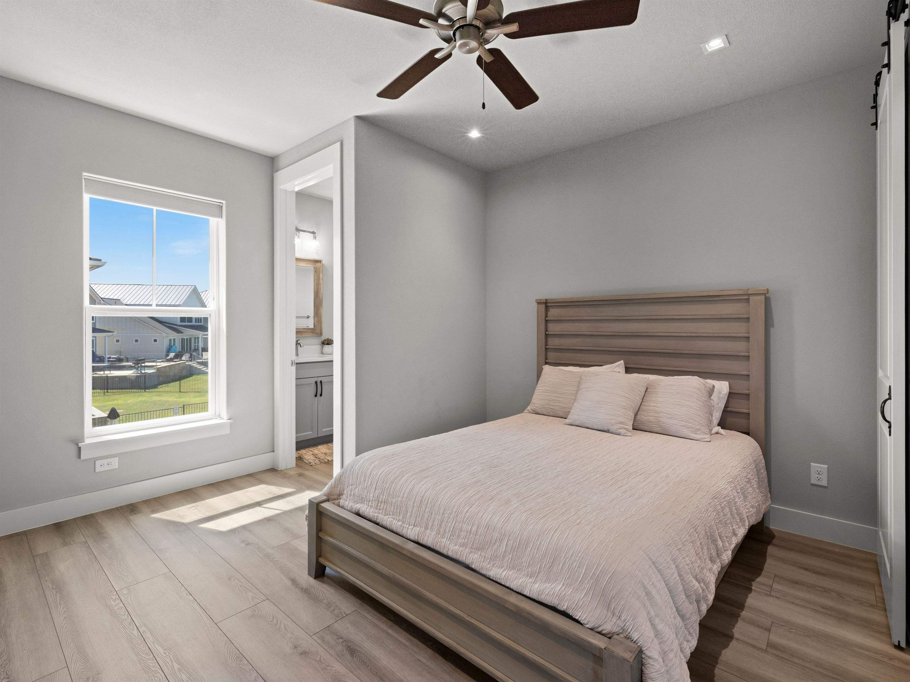 200 Archview Lane Kingsland, TX 78639 - Photo 13 of 45 a bedroom with a large bed and a window