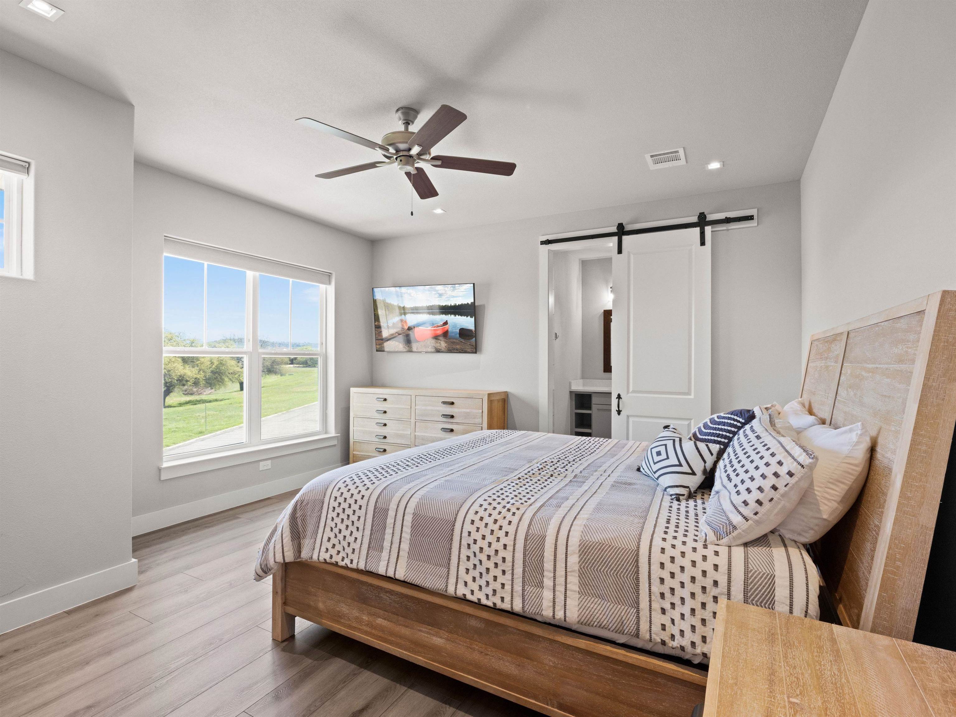 200 Archview Lane Kingsland, TX 78639 - Photo 16 of 45 a bedroom with a bed and a window