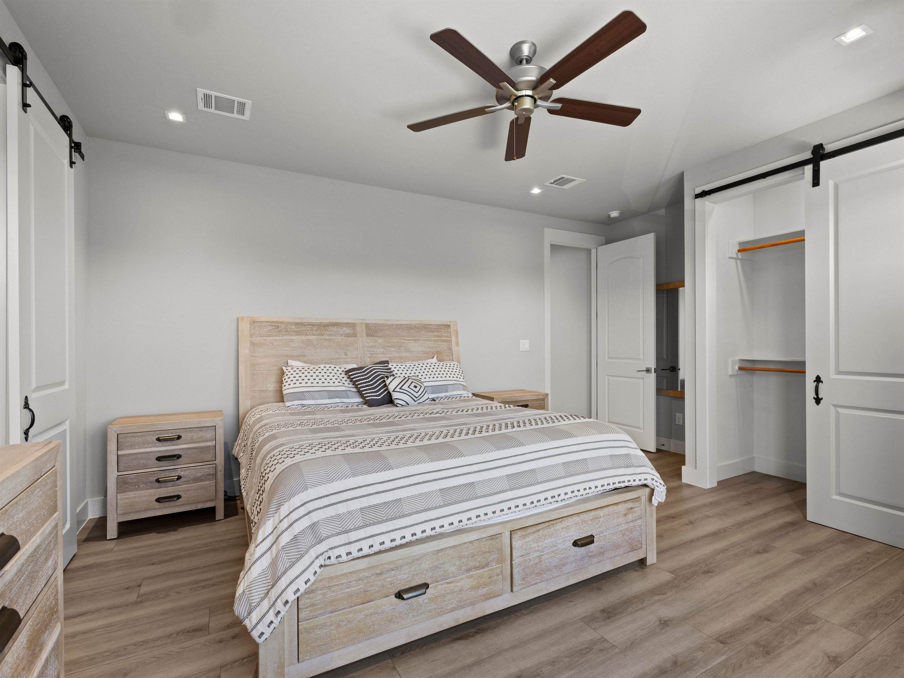 200 Archview Lane Kingsland, TX 78639 - Photo 17 of 45 a bedroom with a bed and a ceiling fan