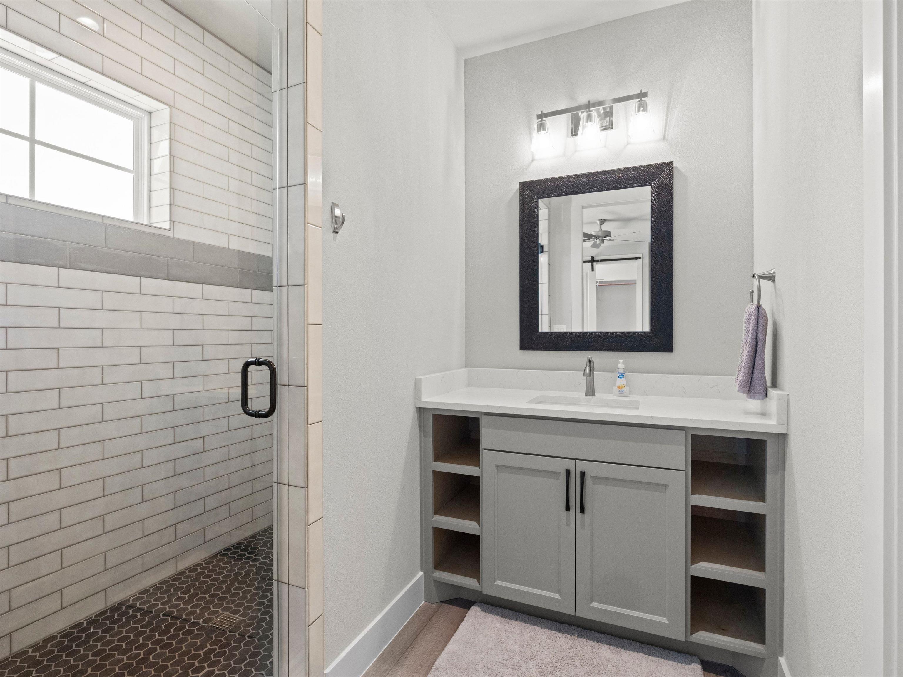 200 Archview Lane Kingsland, TX 78639 - Photo 18 of 45 a bathroom with a toilet sink and mirror