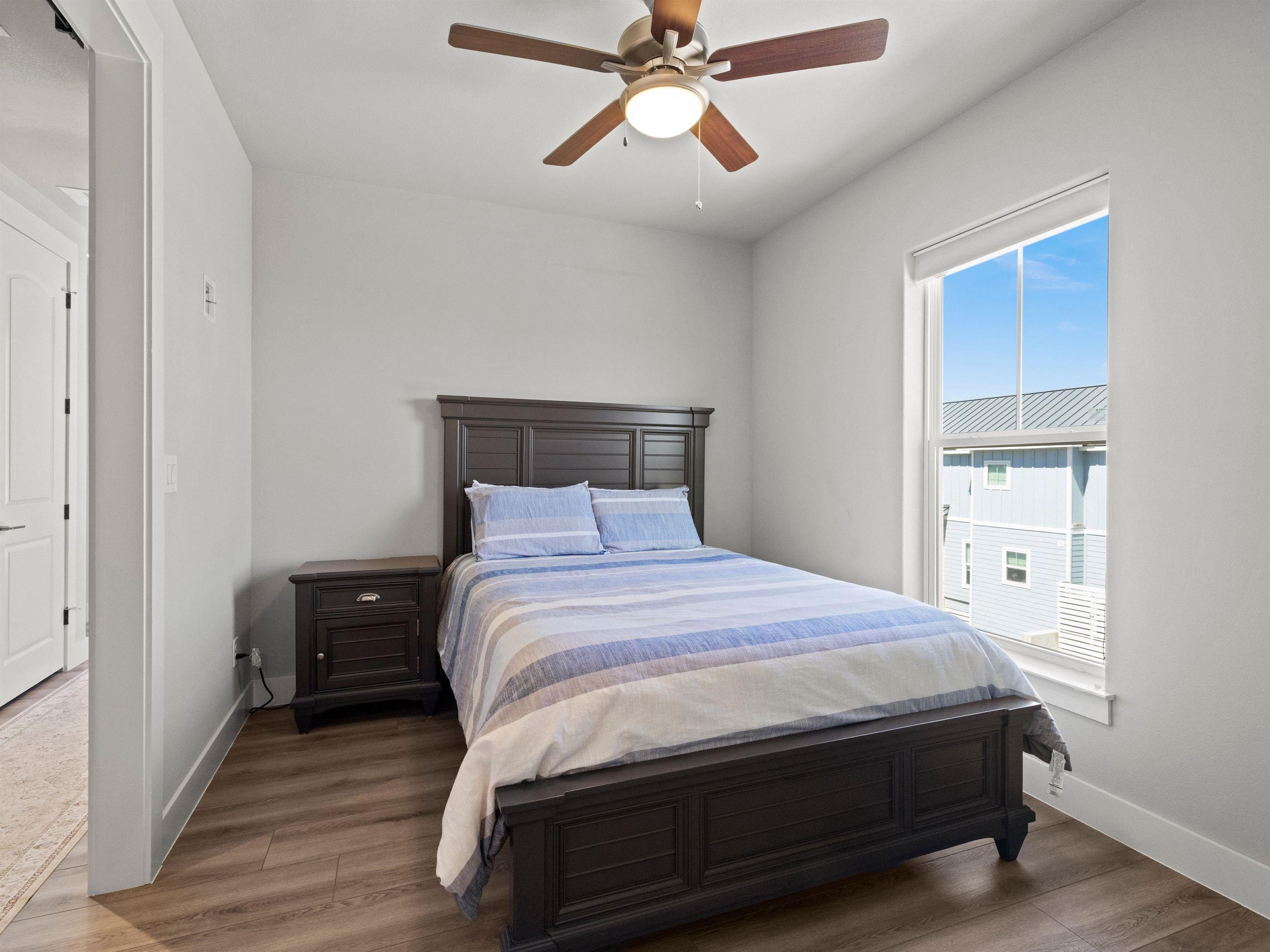 200 Archview Lane Kingsland, TX 78639 - Photo 19 of 45 a bedroom with a bed and wooden floor