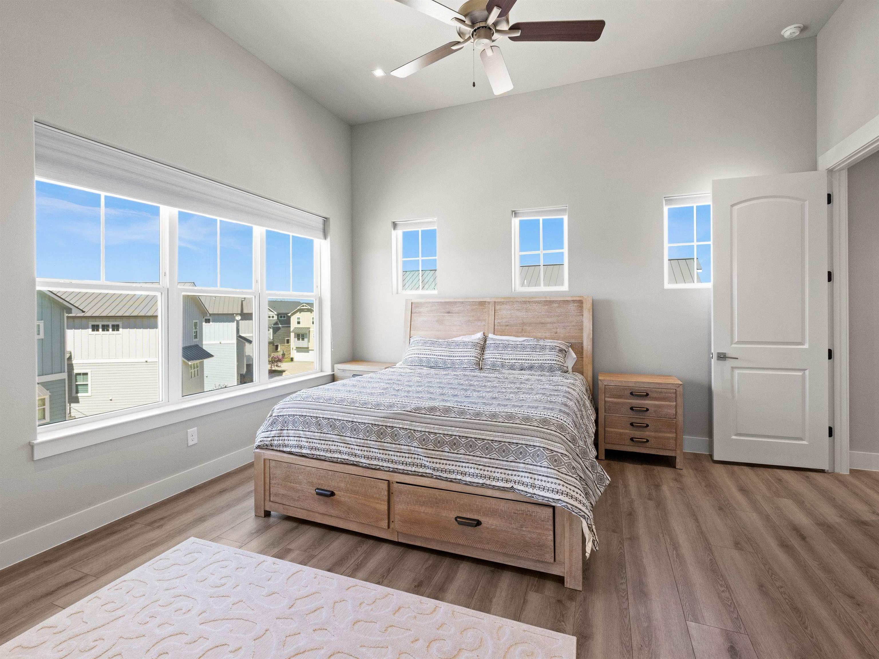 200 Archview Lane Kingsland, TX 78639 - Photo 21 of 45 a spacious bedroom with a bed and wooden floor