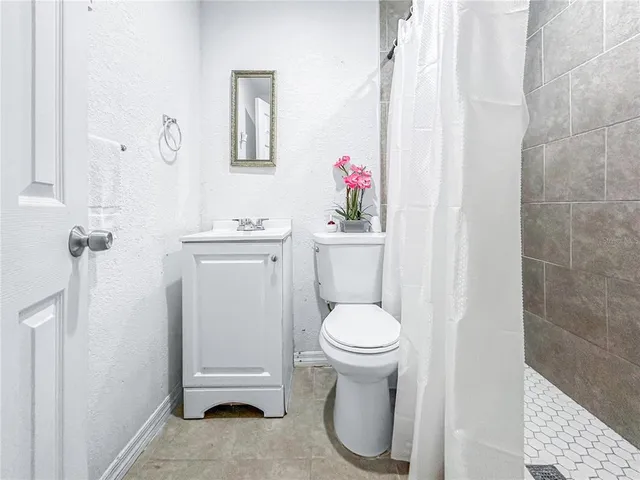a bathroom with a sink toilet and vanity