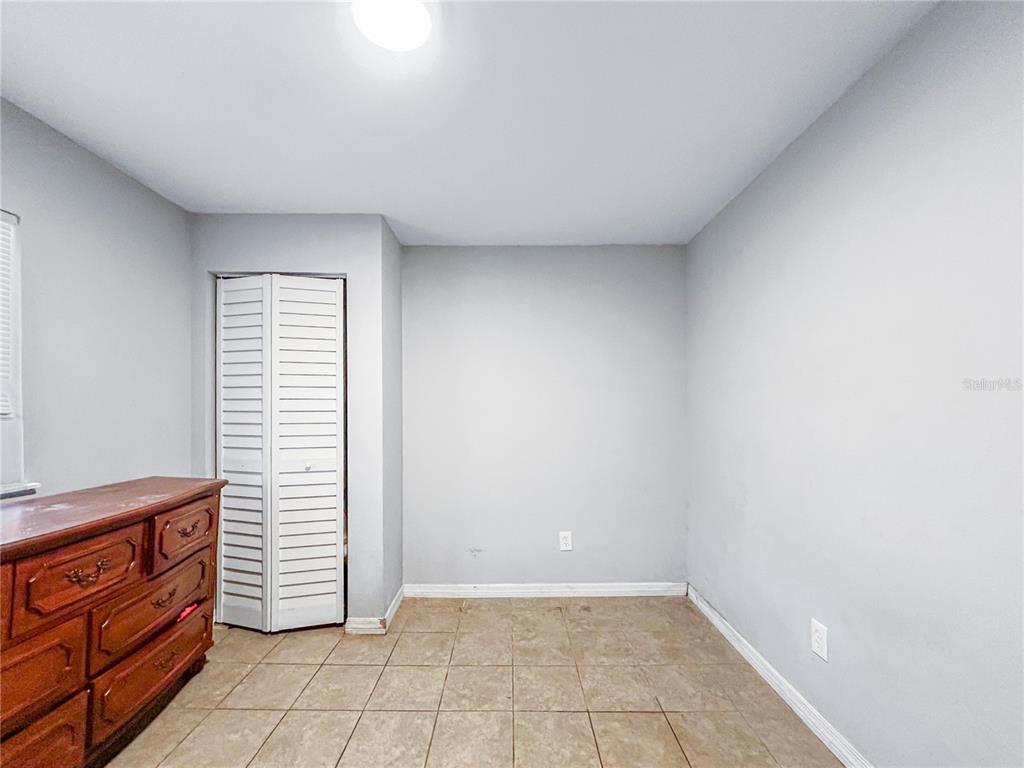 17447 Bathurst Avenue Spring Hill, FL 34610 - Photo 8 of 19 a view of room with window and cabinet