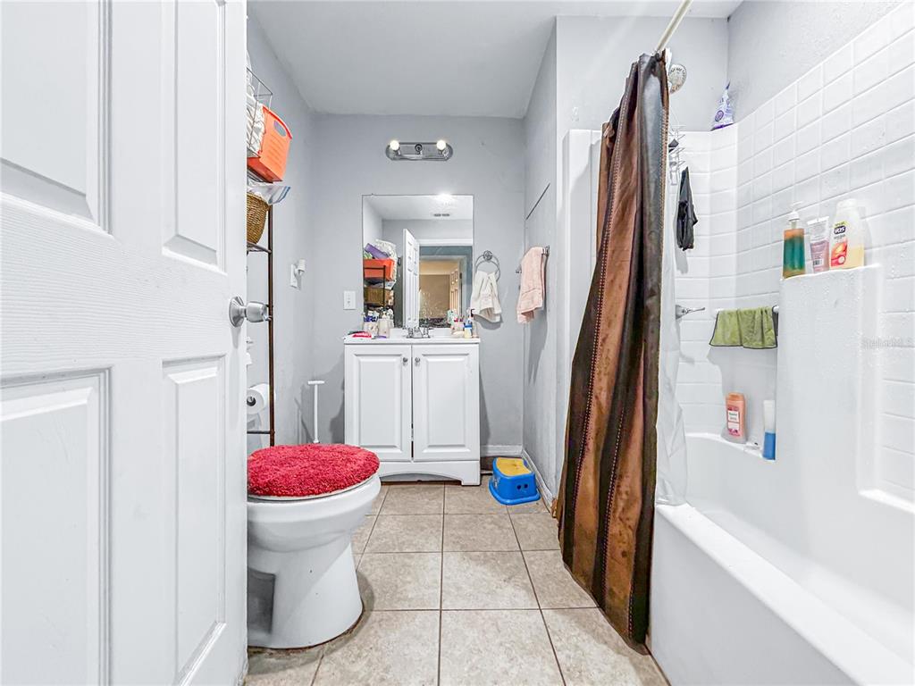 17447 Bathurst Avenue Spring Hill, FL 34610 - Photo 9 of 19 a bathroom with a sink toilet and shower
