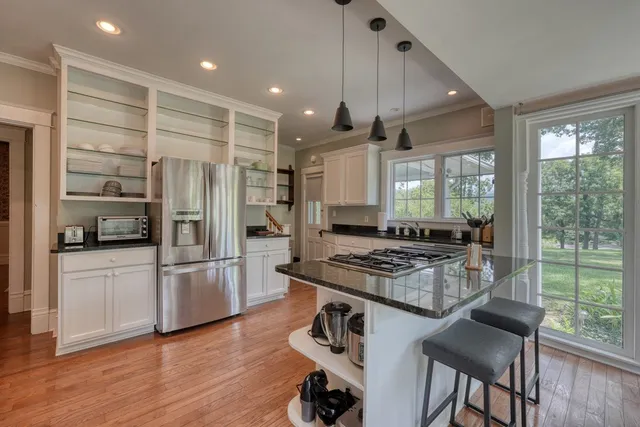 a view of an entryway with wooden floor