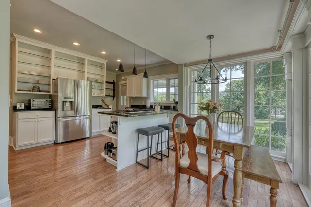 a bathroom with a tub shower and sink