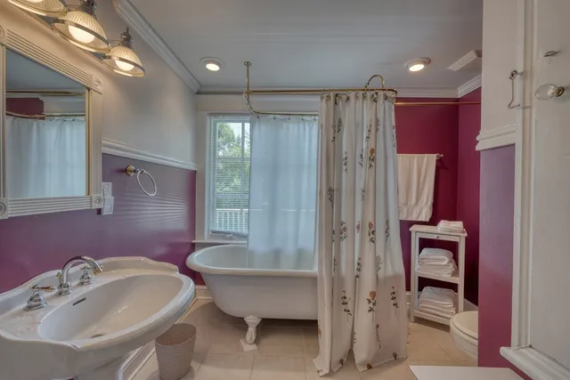 a view of a chair and table in the backyard