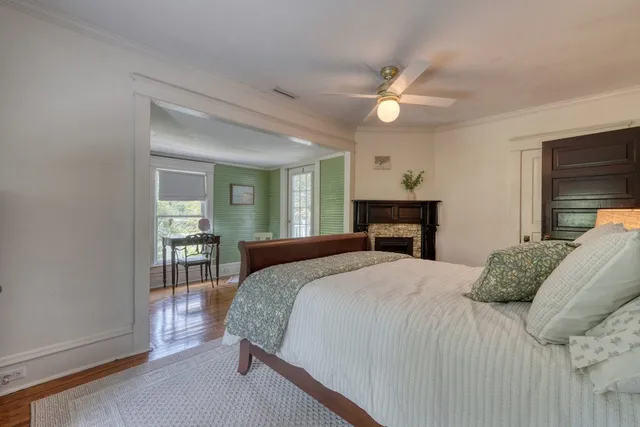 a view of a porch with furniture and wooden floor