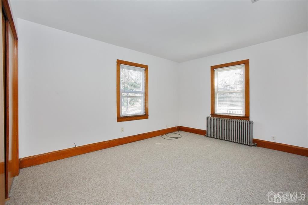 173 Cottrell Road Old Bridge, NJ 07747 - Photo 14 of 28 an empty room with a window