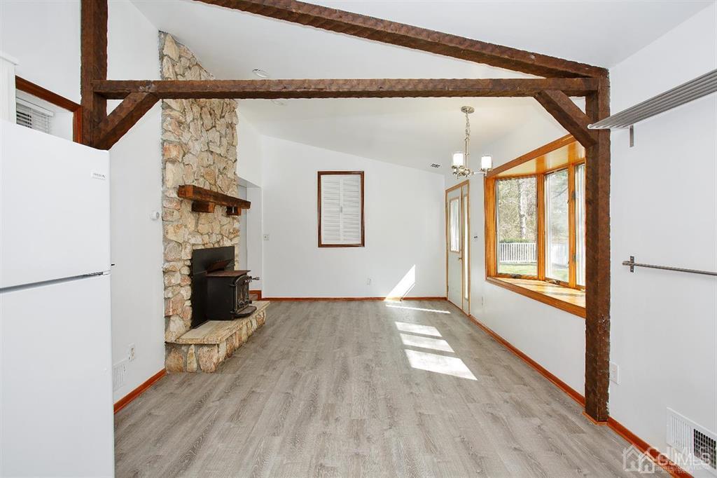 173 Cottrell Road Old Bridge, NJ 07747 - Photo 21 of 28 a view of empty room with wooden floor and windows
