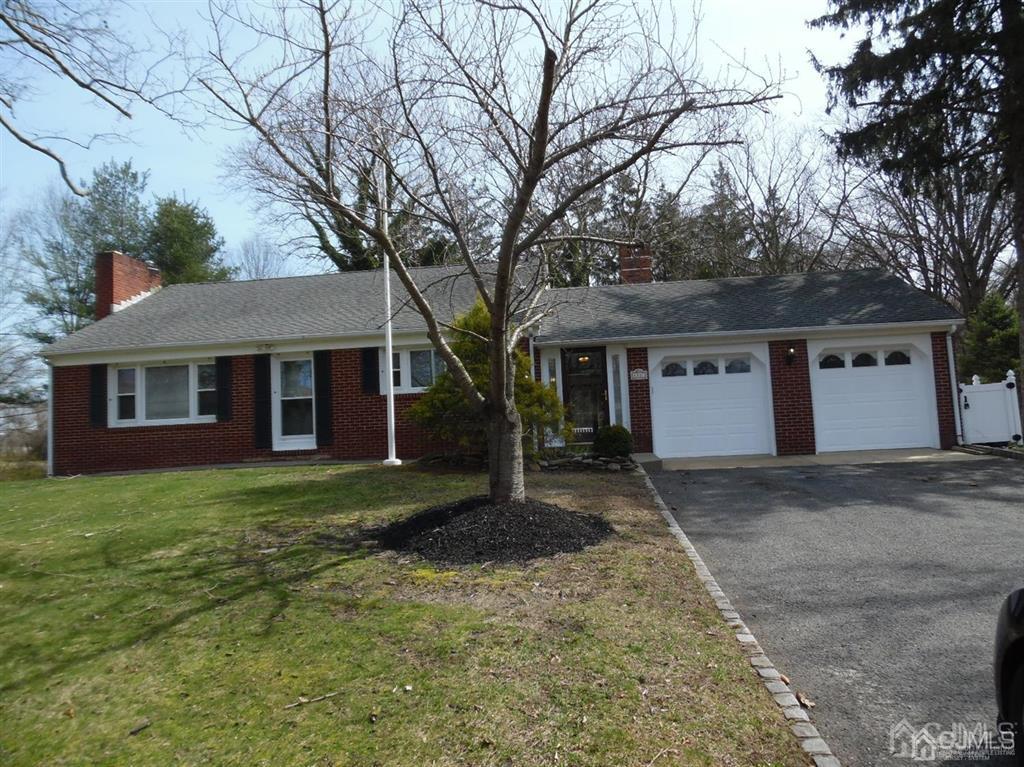 173 Cottrell Road Old Bridge, NJ 07747 - Photo 28 of 28 a view of a yard in front of a house with large tree