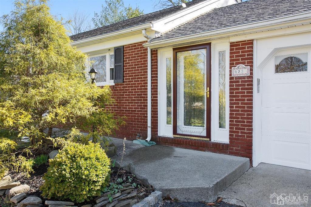 173 Cottrell Road Old Bridge, NJ 07747 - Photo 3 of 28 a front view of a house with a yard