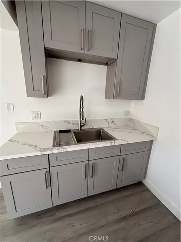 a kitchen with stainless steel appliances granite countertop a sink and cabinets