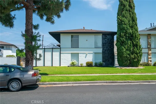 a view of a car in front of a house