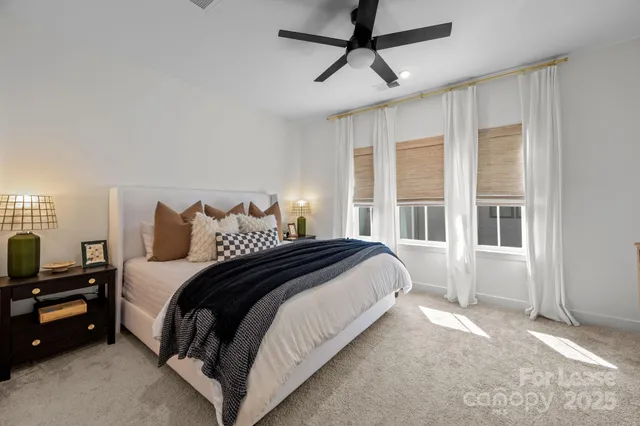 a spacious bedroom with a large bed and a window