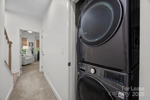 a view of a storage and utility room with a washer and dryer
