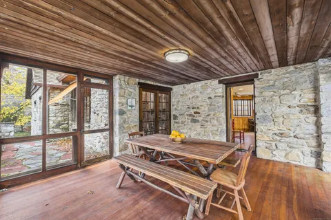 a area with furniture and wooden roof