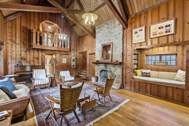 a view of a livingroom with furniture and a fireplace
