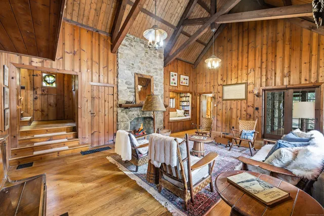 a view of a balcony with couch and chairs