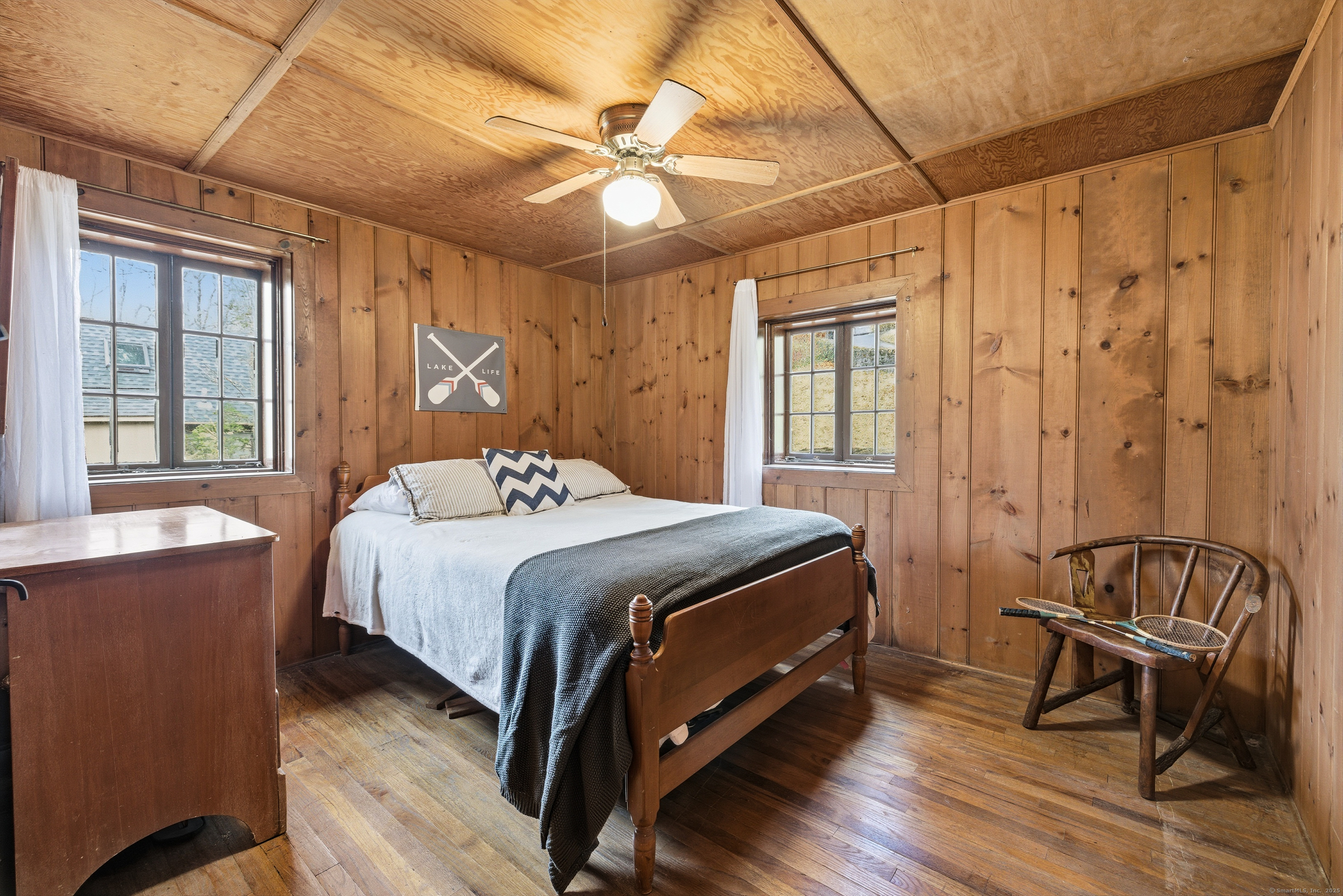 23 Echo Drive New Milford, CT 06776 - Photo 20 of 38 a bedroom with a bed and a chandelier