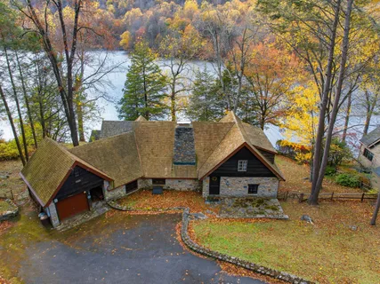 a view of house with trees in the background
