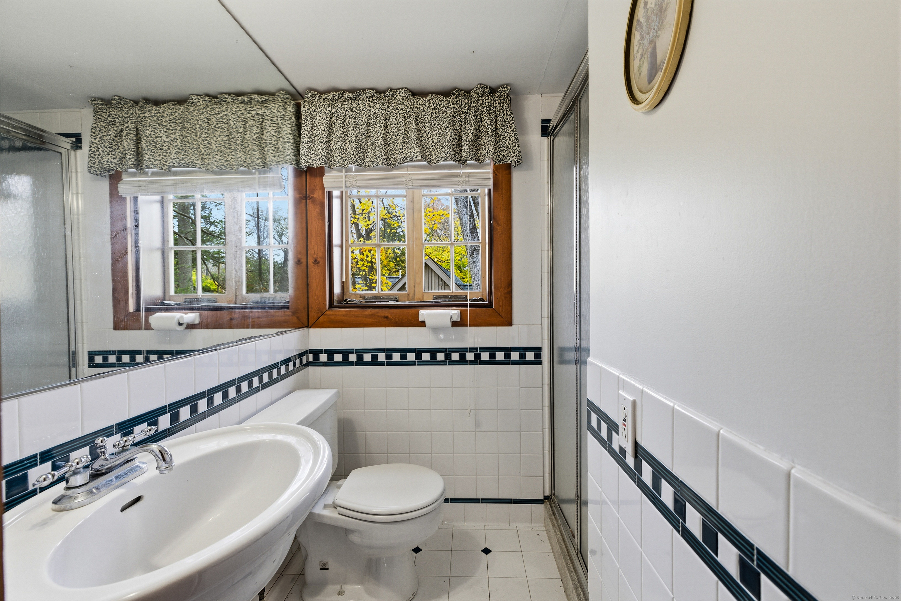 23 Echo Drive New Milford, CT 06776 - Photo 24 of 38 a bathroom with a sink a toilet and shower