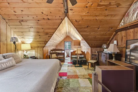 a living room with lots of furniture and a chandelier