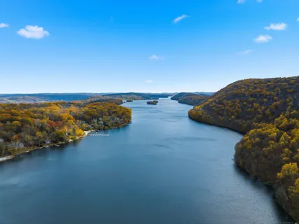 a front view of house with a yard and outdoor seating