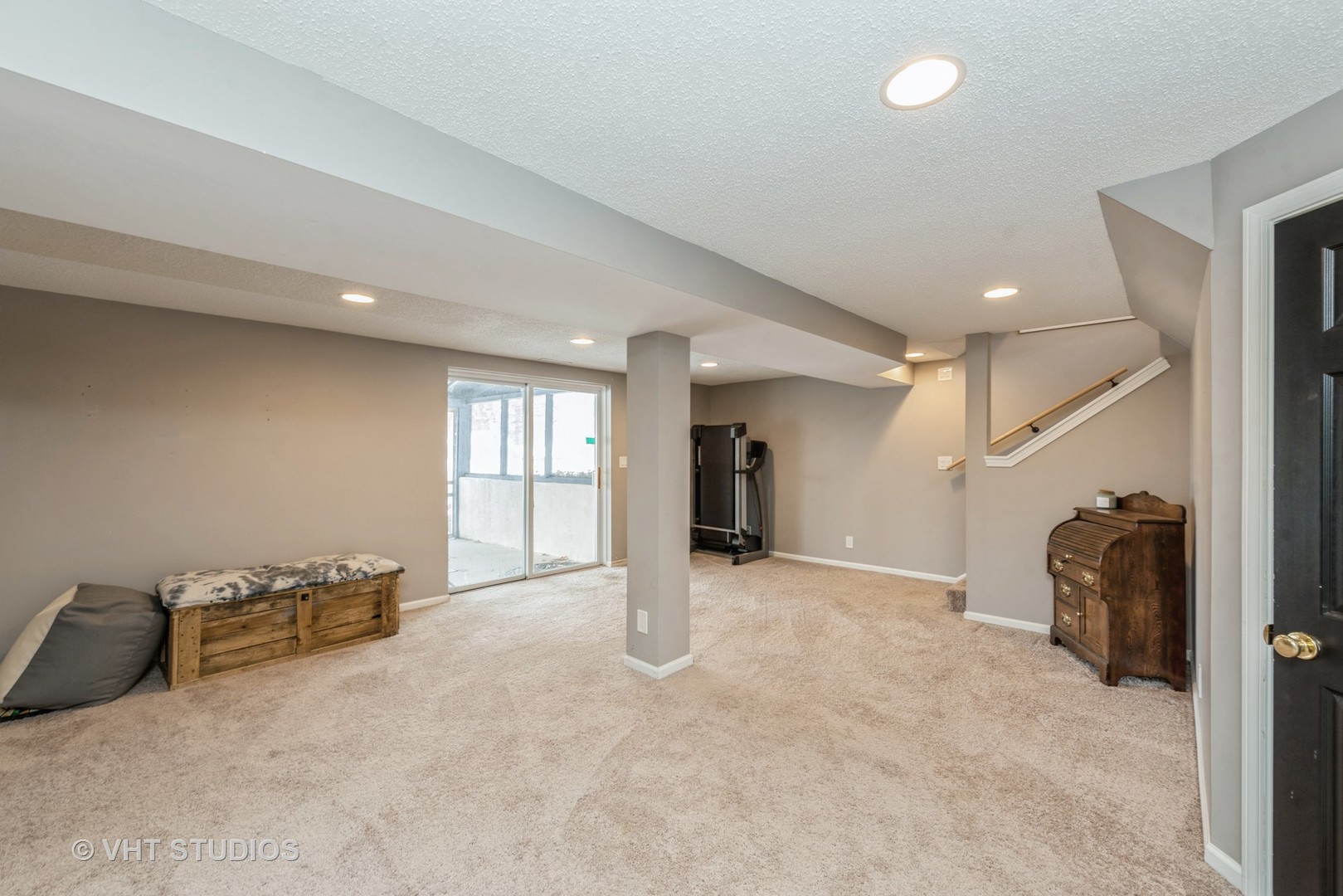 7712 Cedar Road Wonder Lake, IL 60097 - Photo 12 of 19 a view of a livingroom with a staircase