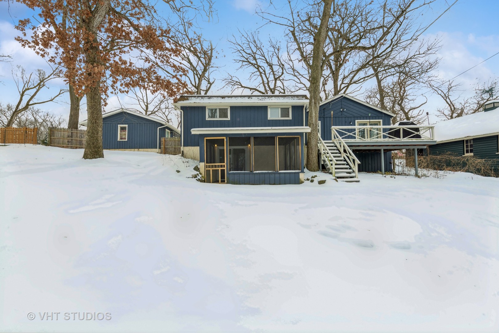 7712 Cedar Road Wonder Lake, IL 60097 - Photo 18 of 19 a front view of a house with a yard covered in snow