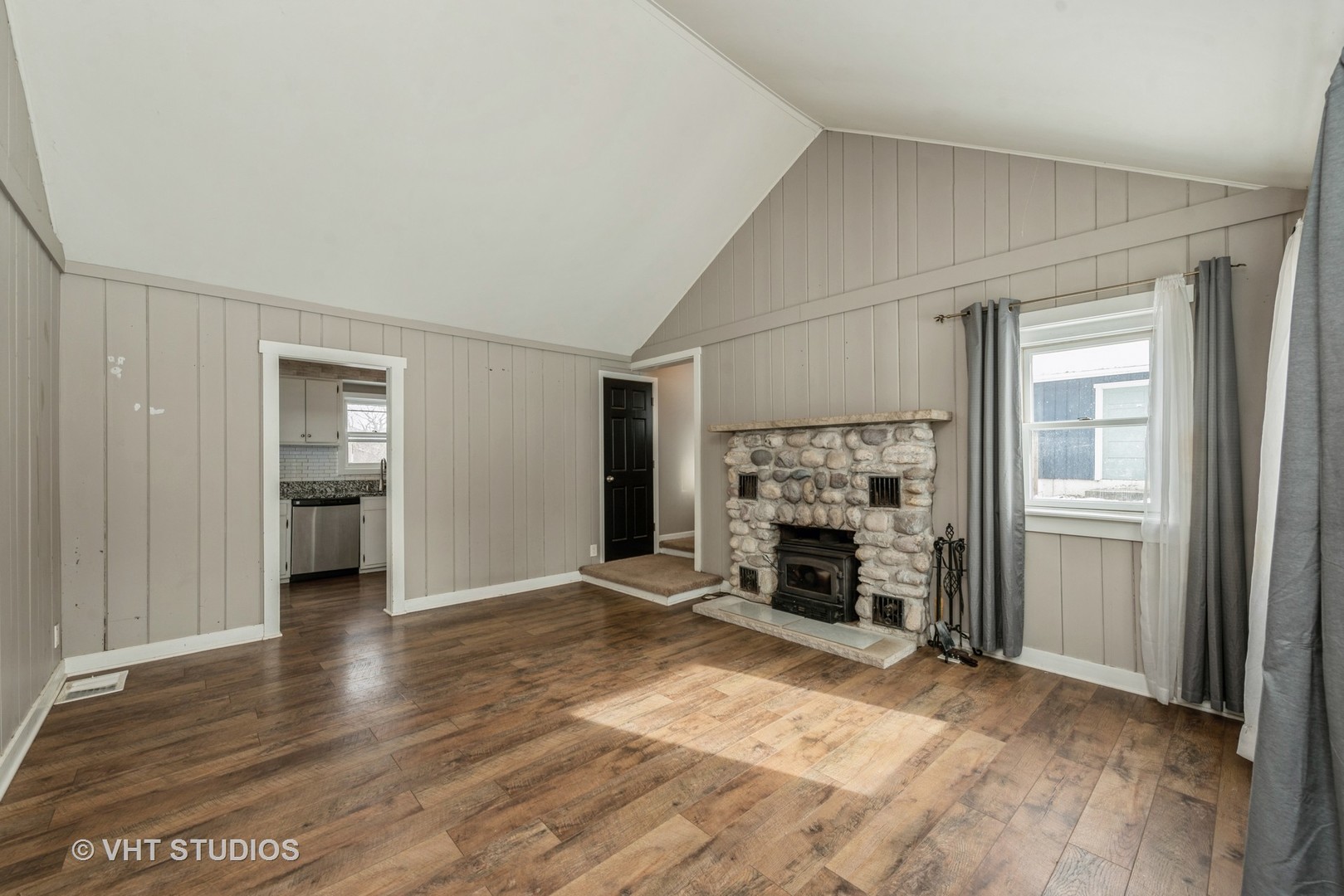 7712 Cedar Road Wonder Lake, IL 60097 - Photo 5 of 19 an empty room with fireplace and window