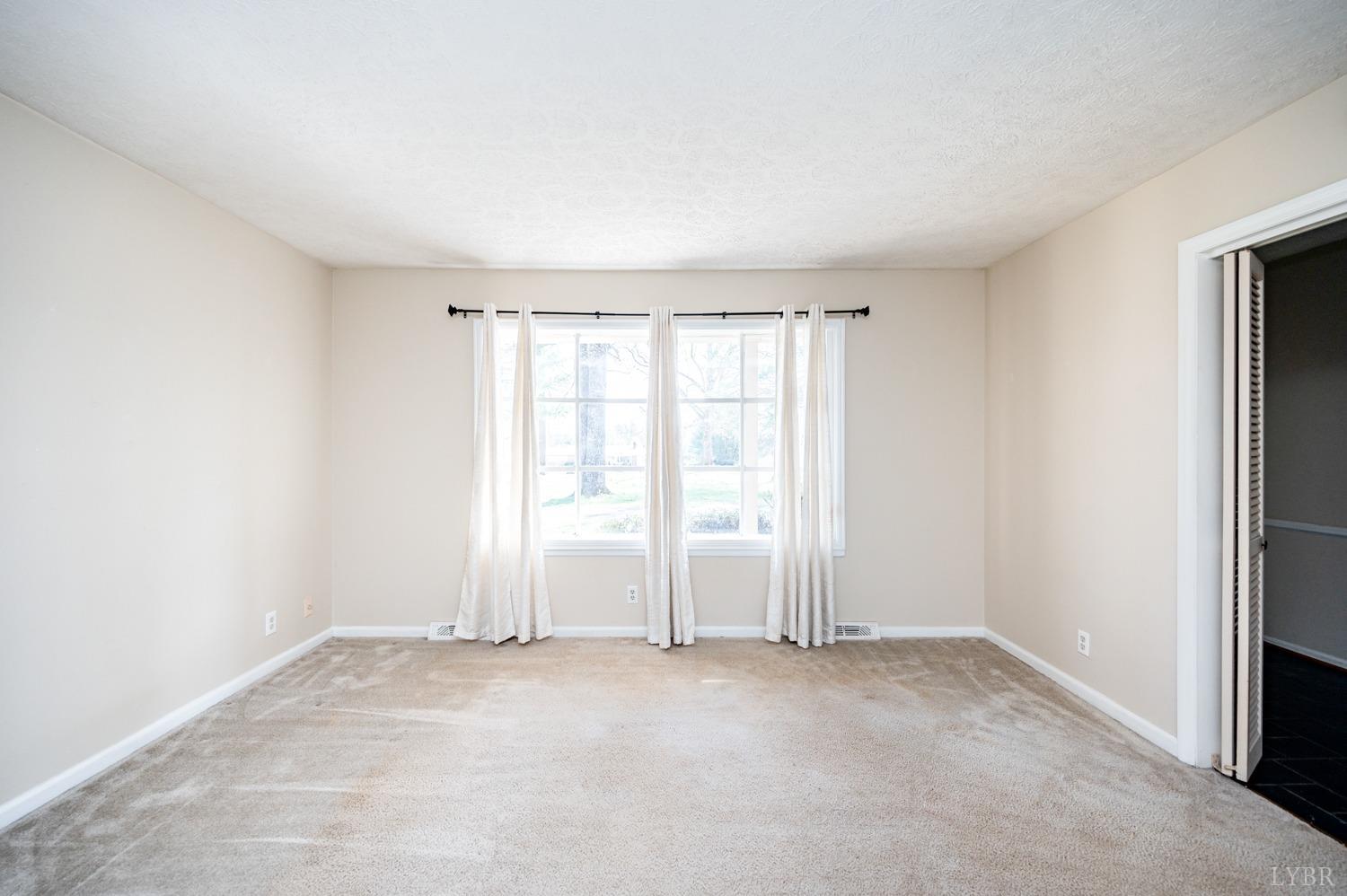 527 Gough Road Rustburg, VA 24588 - Photo 11 of 59 an empty room with windows