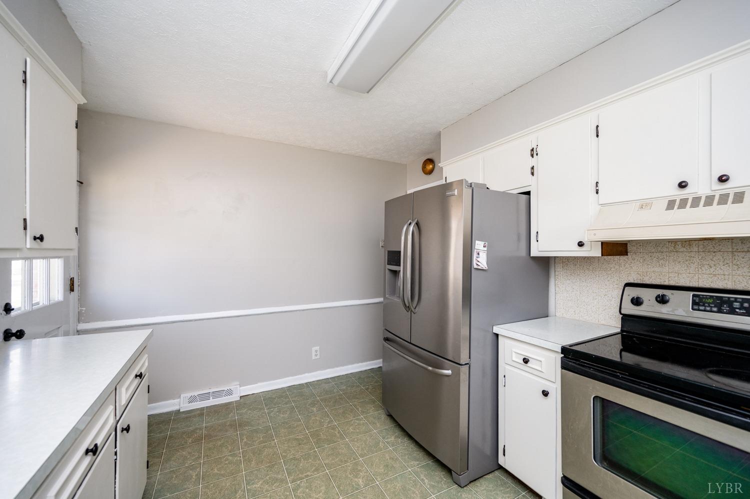 527 Gough Road Rustburg, VA 24588 - Photo 15 of 59 a kitchen with a refrigerator sink and stove