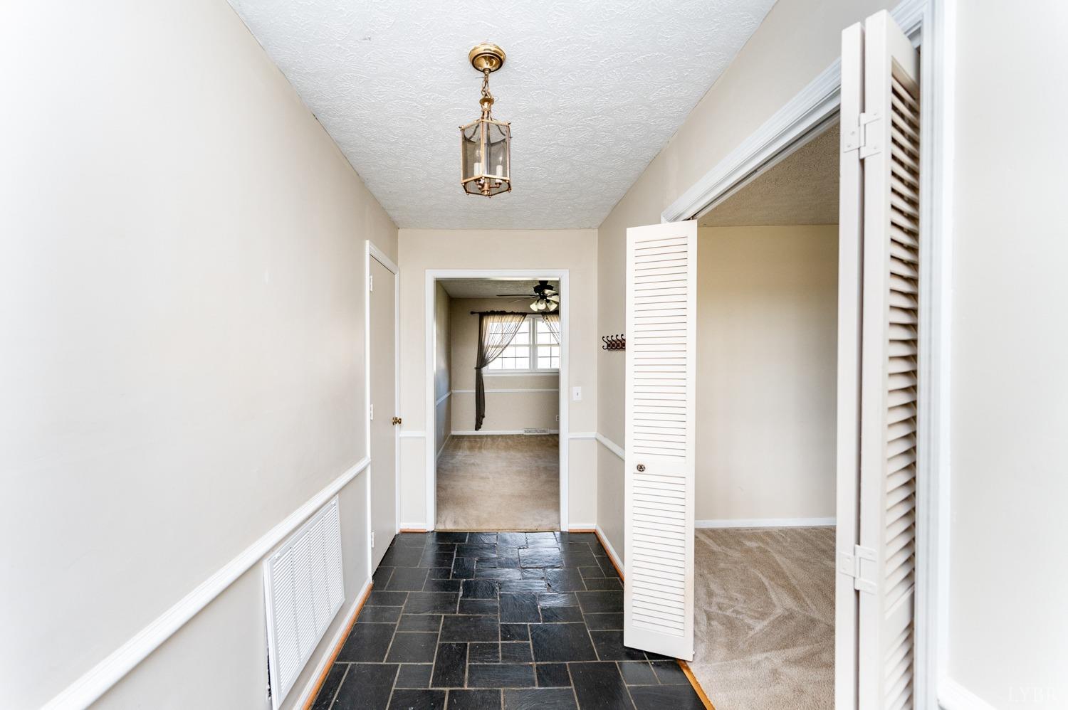 527 Gough Road Rustburg, VA 24588 - Photo 19 of 59 a view of a hallway with wooden floor and staircase