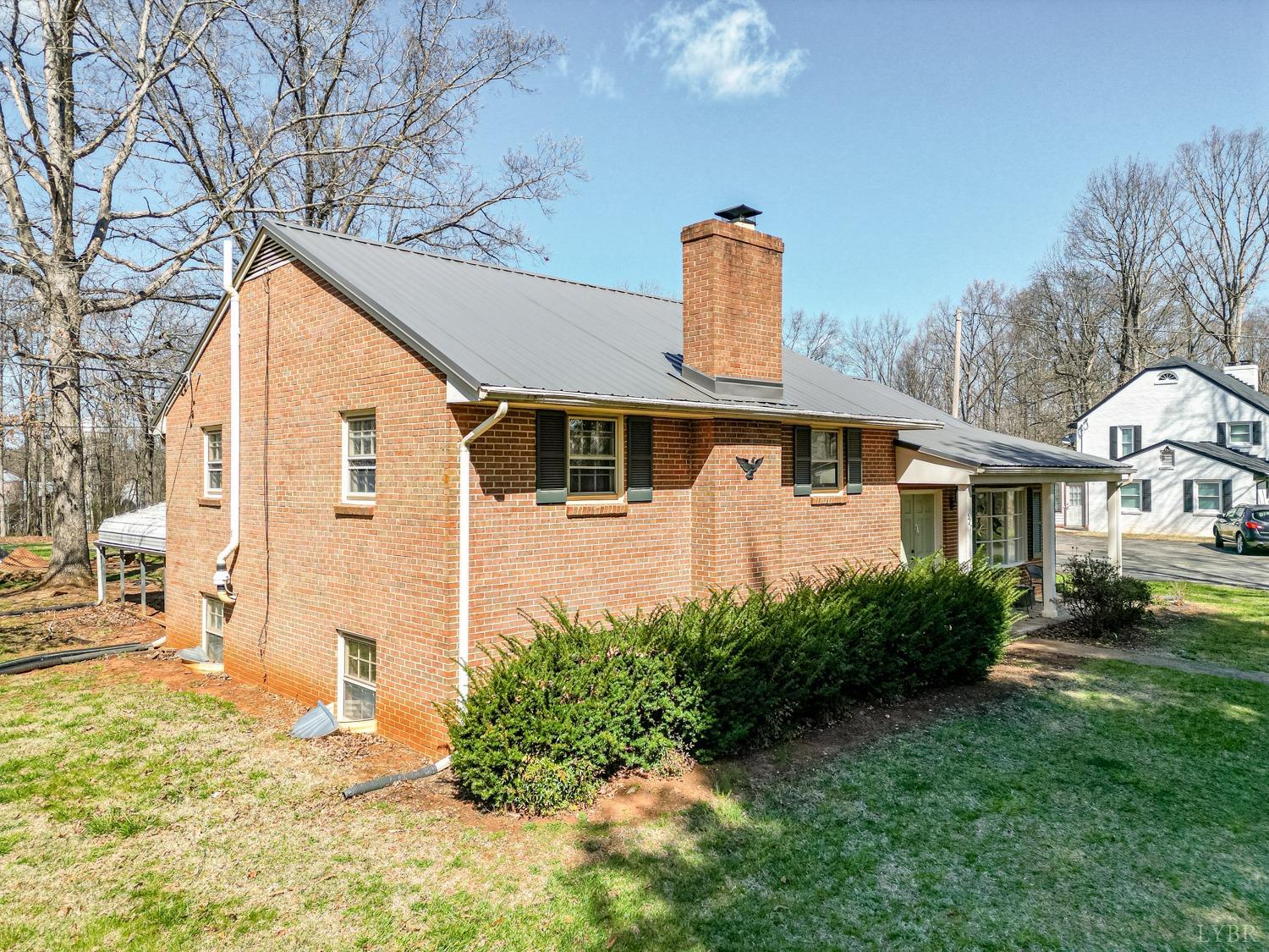527 Gough Road Rustburg, VA 24588 - Photo 40 of 59 a front view of a house with garden