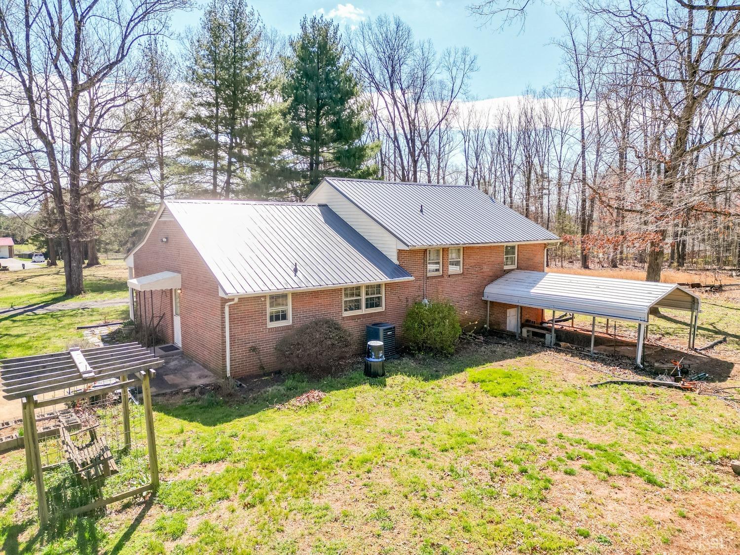 527 Gough Road Rustburg, VA 24588 - Photo 44 of 59 a view of a house with a yard and sitting area