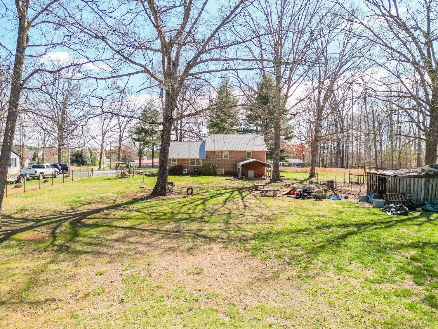 527 Gough Road Rustburg, VA 24588 - Photo 46 of 59 a view of yard with swimming pool and trees