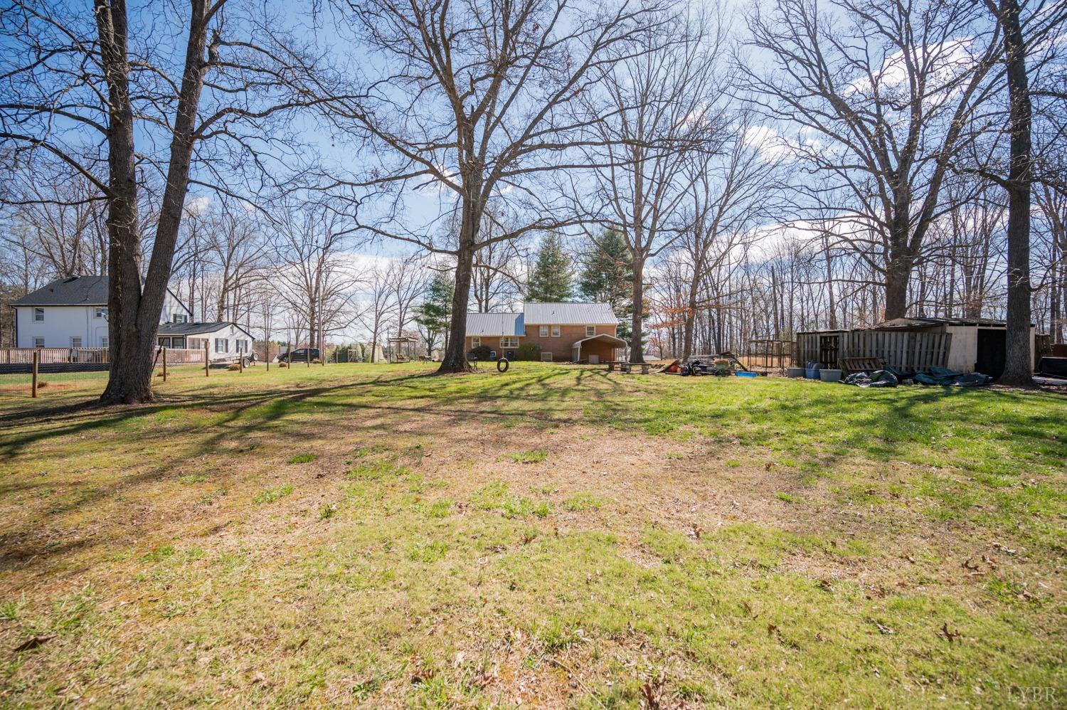 527 Gough Road Rustburg, VA 24588 - Photo 6 of 59 a view of a yard with a large tree