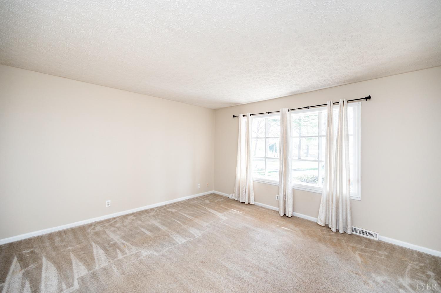 527 Gough Road Rustburg, VA 24588 - Photo 10 of 59 an empty room with windows