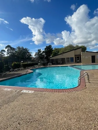 a view of a house with a swimming pool