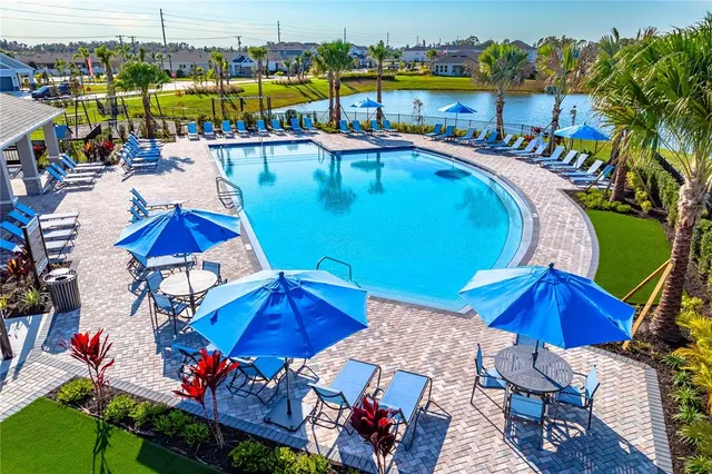 a view of a swimming pool with an outdoor seating