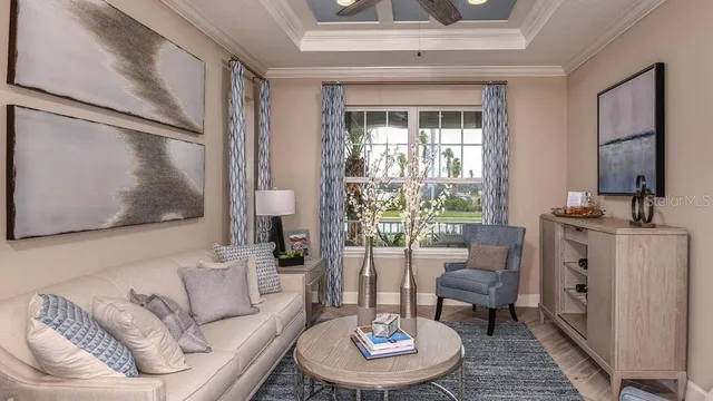 a kitchen with stainless steel appliances kitchen island granite countertop a table chairs and a refrigerator