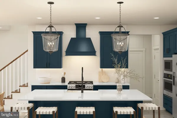 a kitchen with stainless steel appliances granite countertop a sink a stove and a wooden floor