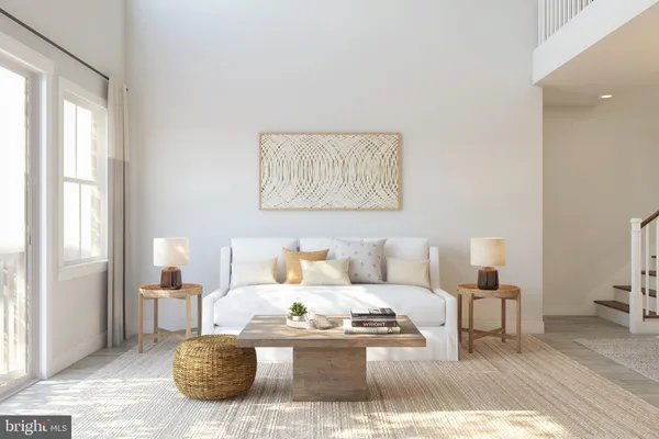 a living room with furniture and a lamp