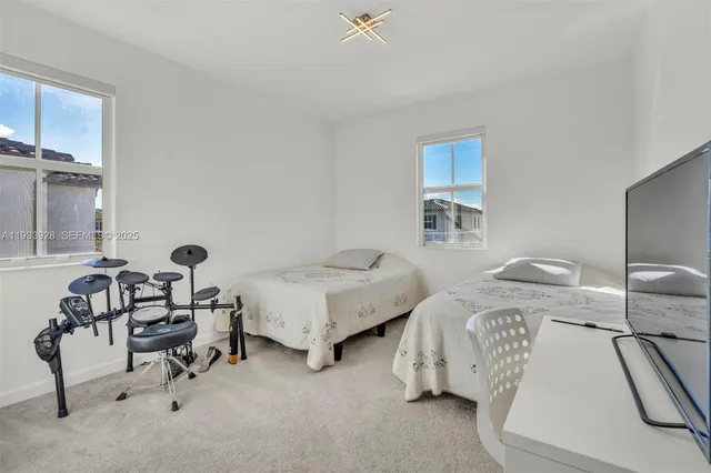 a utility room with two washing machine