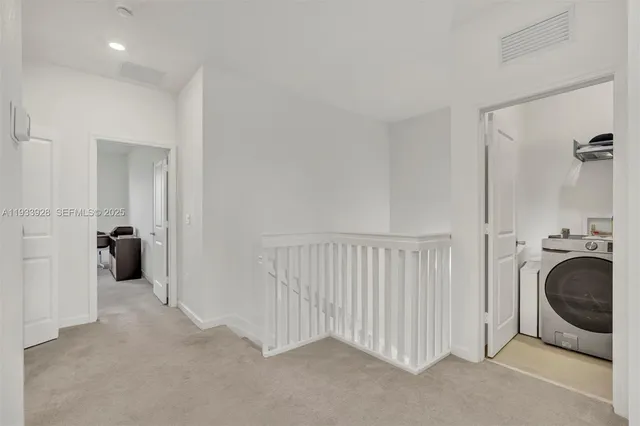 a view of a livingroom with wooden floor and cabinet