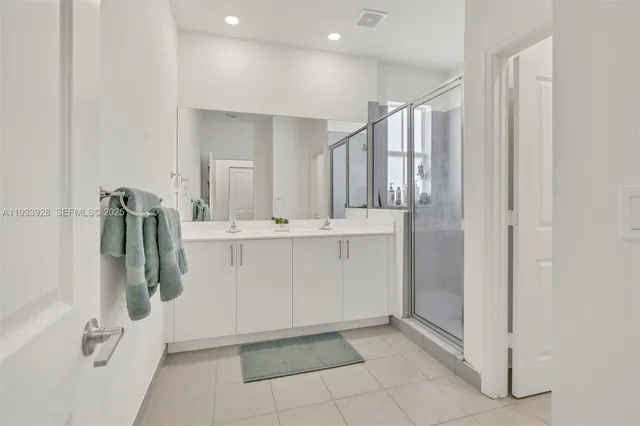 a bathroom with a sink and mirror