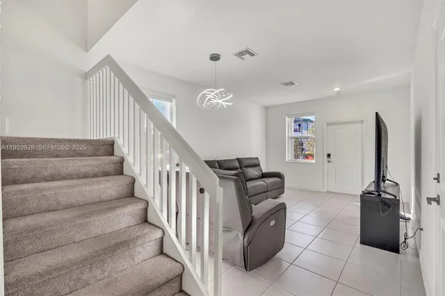 a view of entryway with stairs and furniture